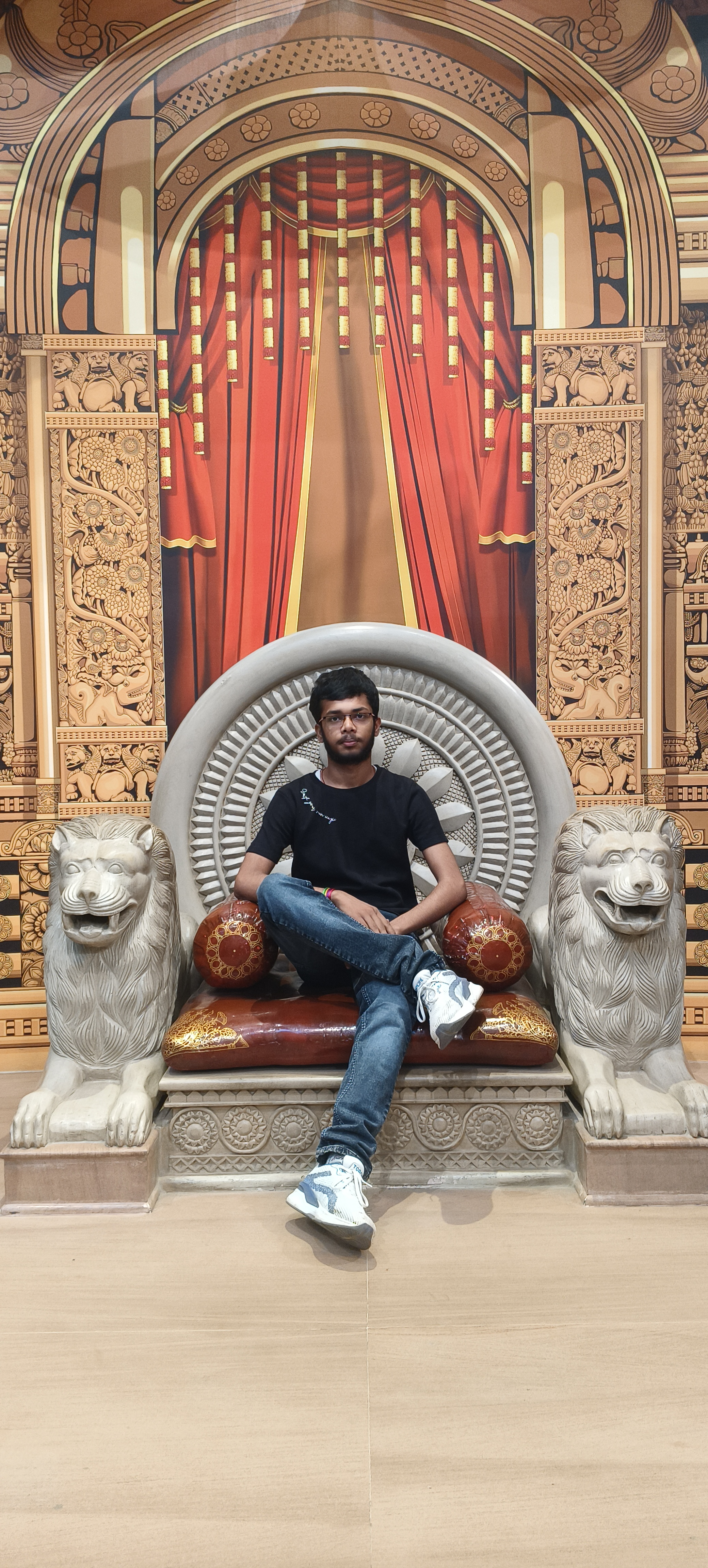 Divyam sitting on a throne like a king