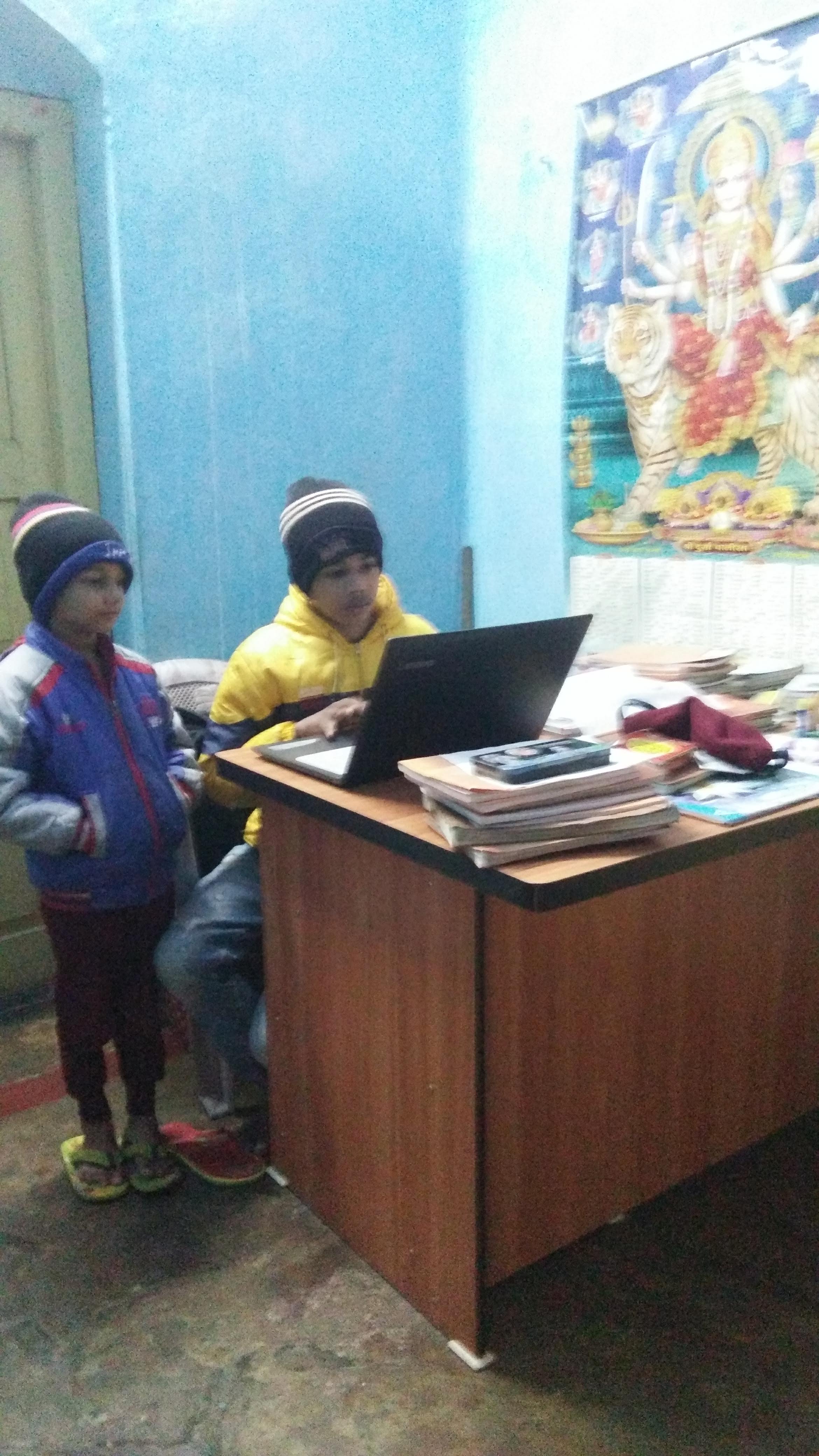 Divyam working on laptop coding tryout