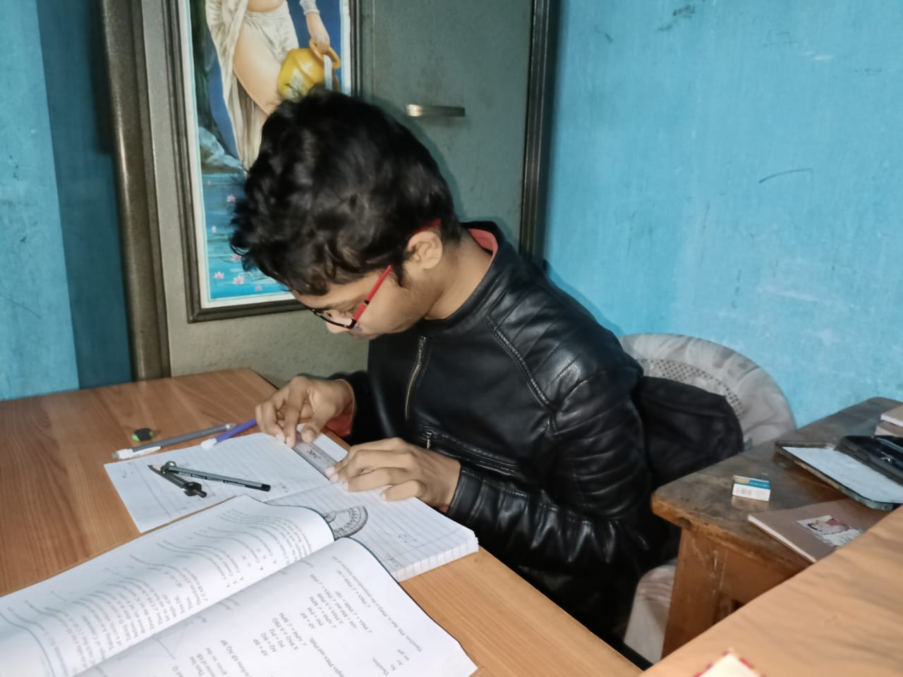 Divyam standing near ship background